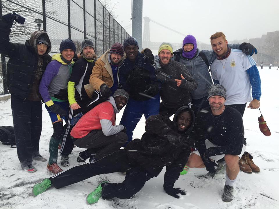 The East River Park Saturday soccer group with Lars Magnus Fylke posing for a picture after playing soccer in a blizzard.